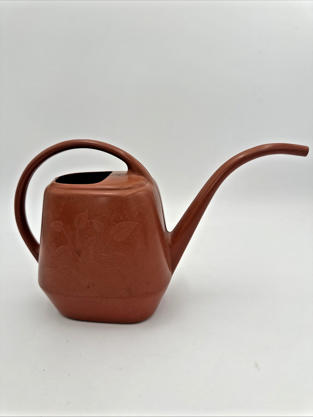 VTG Plastic Watering Can Garden Scene Made In USA Burnt Orange Embossed Leaves